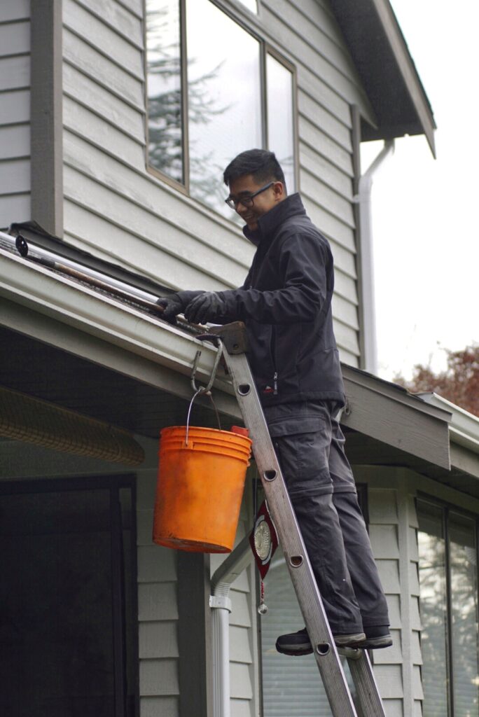A professional gutter cleaning Victoria service in action